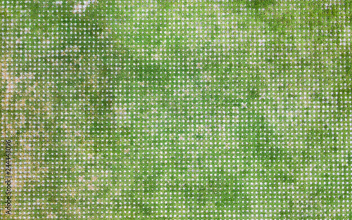 square concrete block with green grass on the walkway