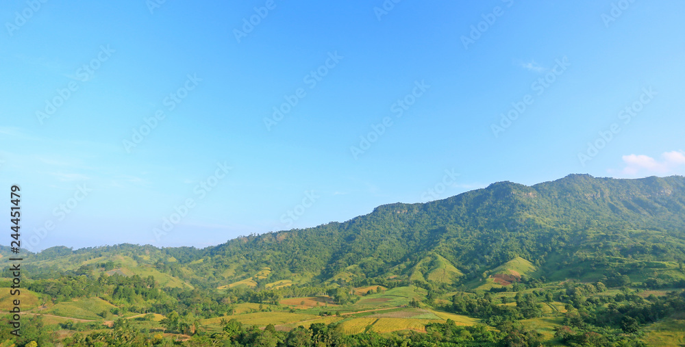Beautiful mountain landscape with mountain forest and blue sky in Thailand.