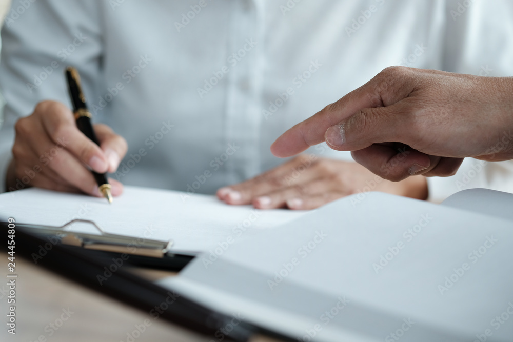Legal counsel presents to the client a signed contract with gavel and legal law. justice and lawyer concept. Legal counsel presents to the client a signed contract with gavel and legal law. justice and lawyer concept.