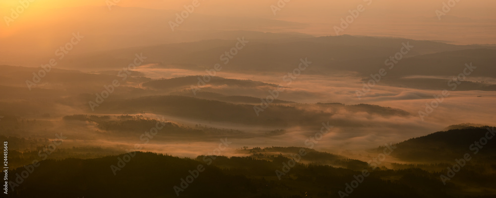 Beautiful, misty dawn in a mountain valley. A view from the top of Babia Mountain,Poland