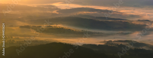 Beautiful, misty dawn in a mountain valley. A view from the top of Babia Mountain,Poland