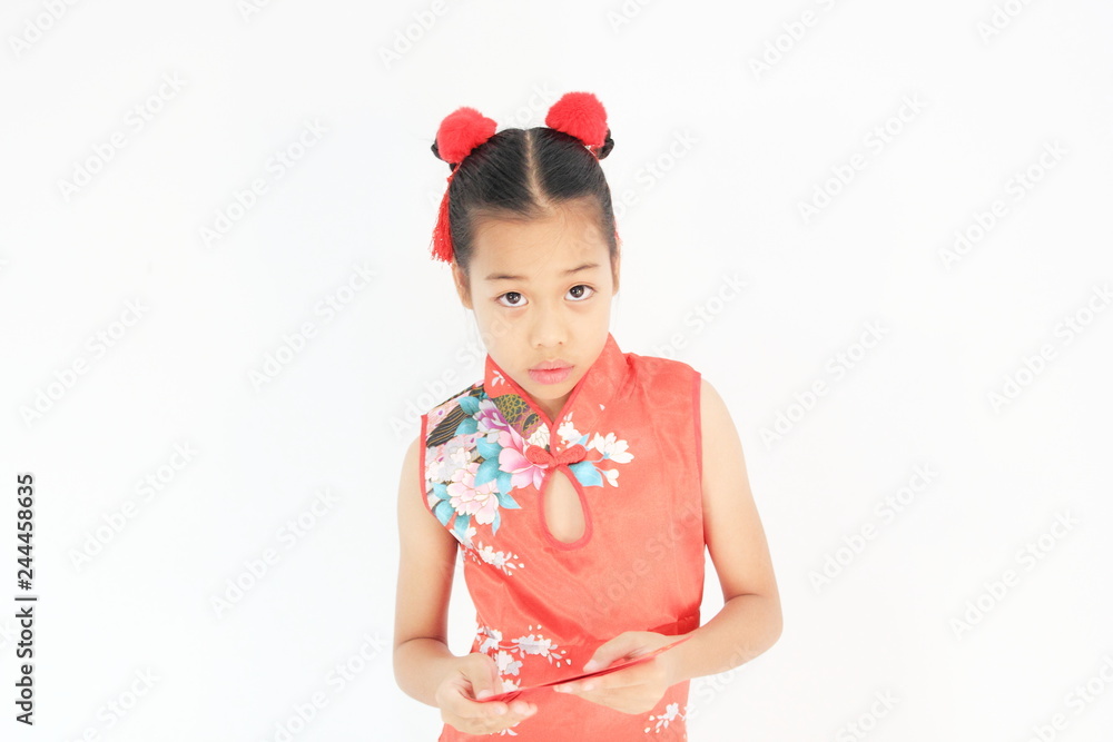 Asian Chinese child happy showing red paper packet gift on isolated white background ,Chinese new year concept. Asian Chinese child happy showing red paper packet gift on isolated white background ,Chinese new year concept.