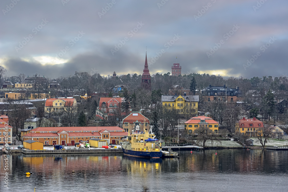 Seaside view of Djurgarden island at winter overcast morning. Stockholm, Sweden.
