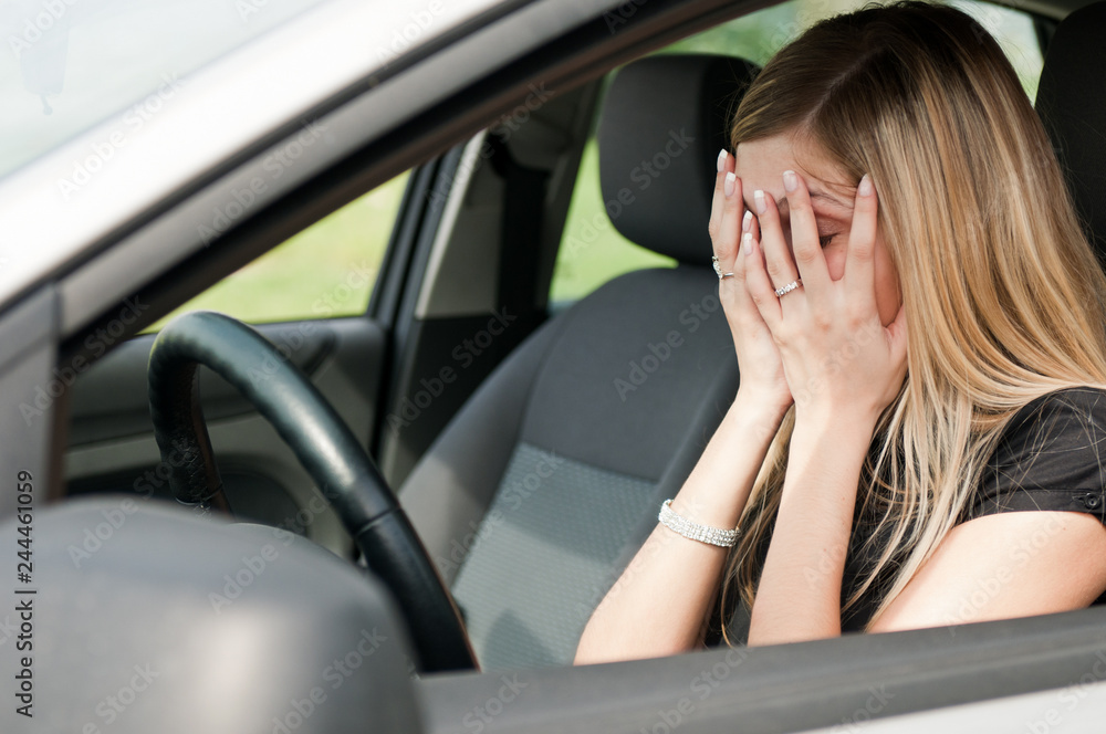 In troubles - unhappy woman in car