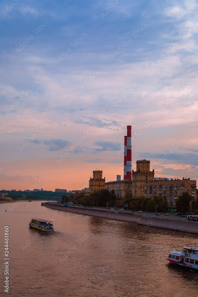 Beautiful night Moscow veiw under sunset blue sky near the river