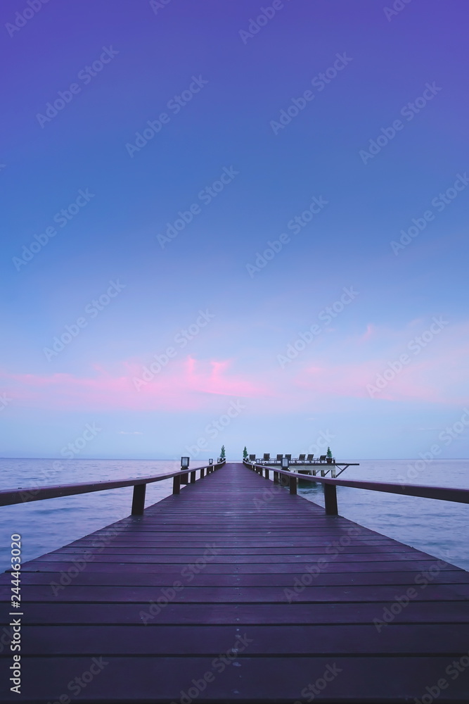 Fototapeta premium Beautiful jetty walkway on the sea in twilight time.
