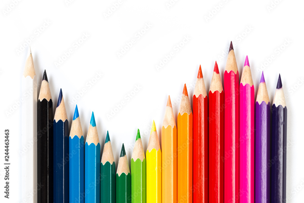 Colour pencils on white background, top view. Colour pencils on white background, top view.