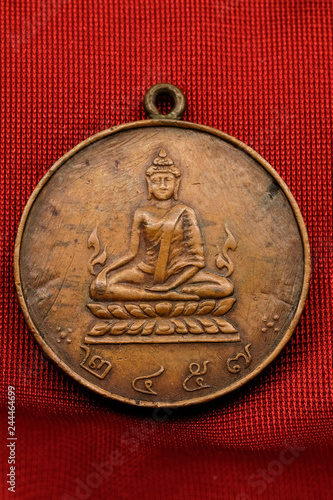 Old Buddha amulet.