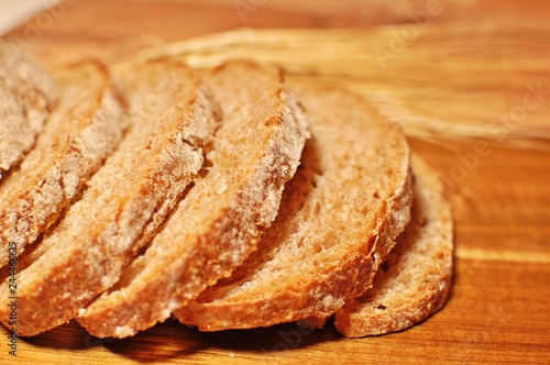 Close up of cereal healthy homemade bread slices on wooden table background. Side view
