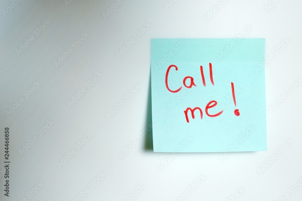 Call me written by hand and put on the white wall Call me written by hand and put on the white wall