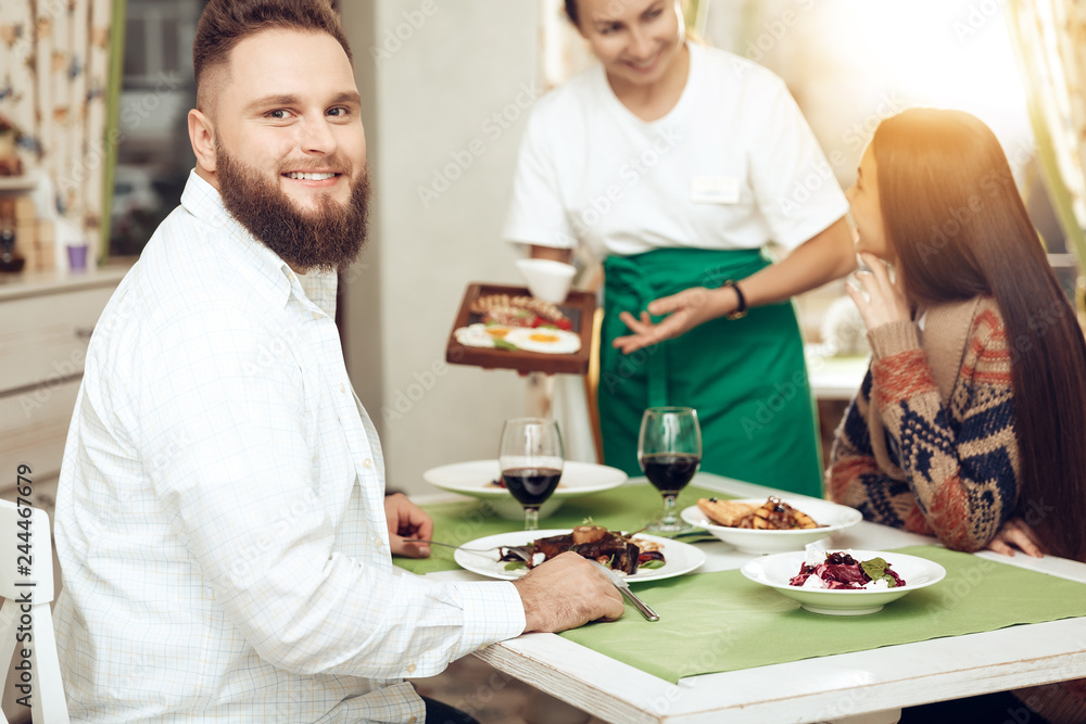 Romantic dinner happy men and women in restaurant Romantic dinner happy men and women in restaurant