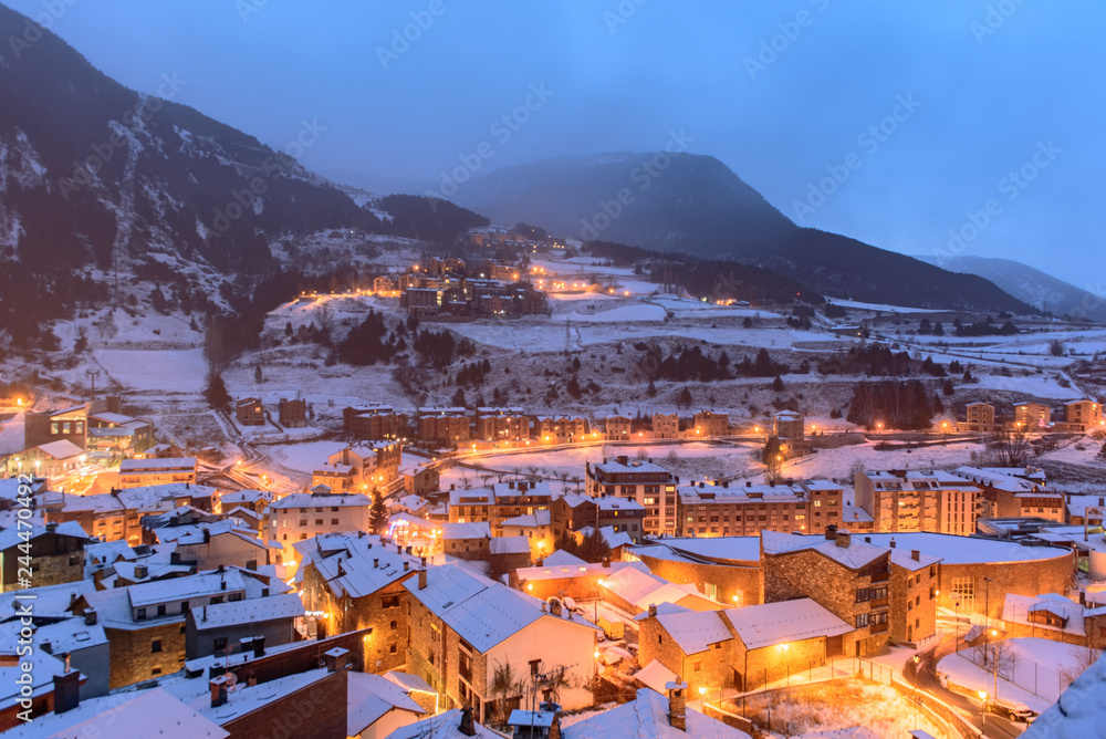 Snowy sunrise in the town of Canillo, Andorra. Cityscape  in Winter.