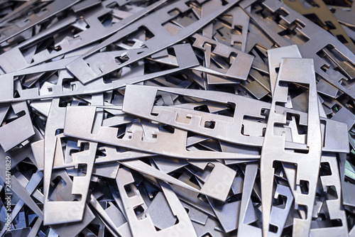 Metal plates after processing on die-cutting press photo