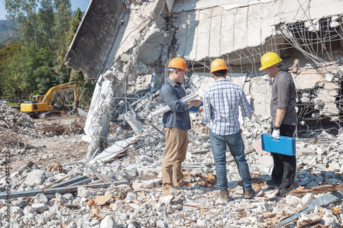 Slika na platnu Engineer architect and worker operation control demolish old building