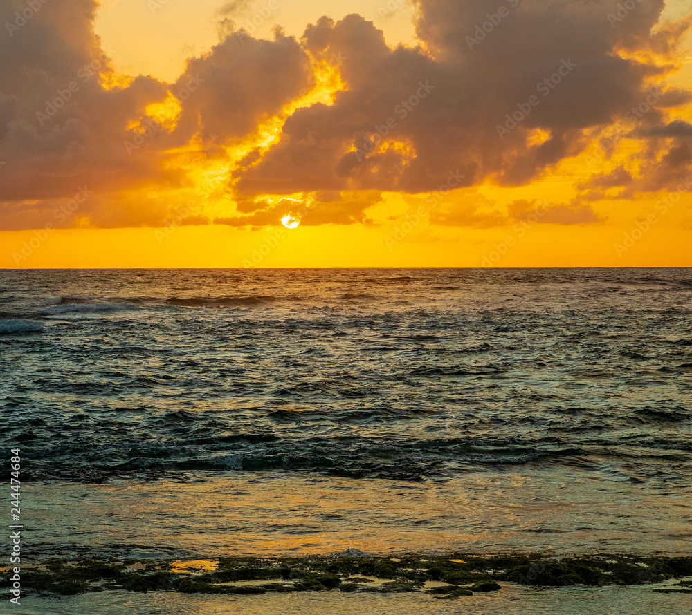 Fototapeta premium Golden sunrise in San Andrés Island, Colombia.