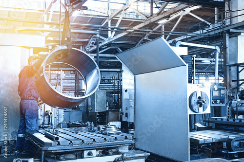 Metal industry: a worker prepares a valve part photo