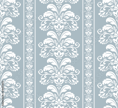 Wallpaper in the style of Baroque. Seamless vector background. White and blue floral ornament. Graphic pattern for fabric, wallpaper, packaging. Ornate Damask flower ornament