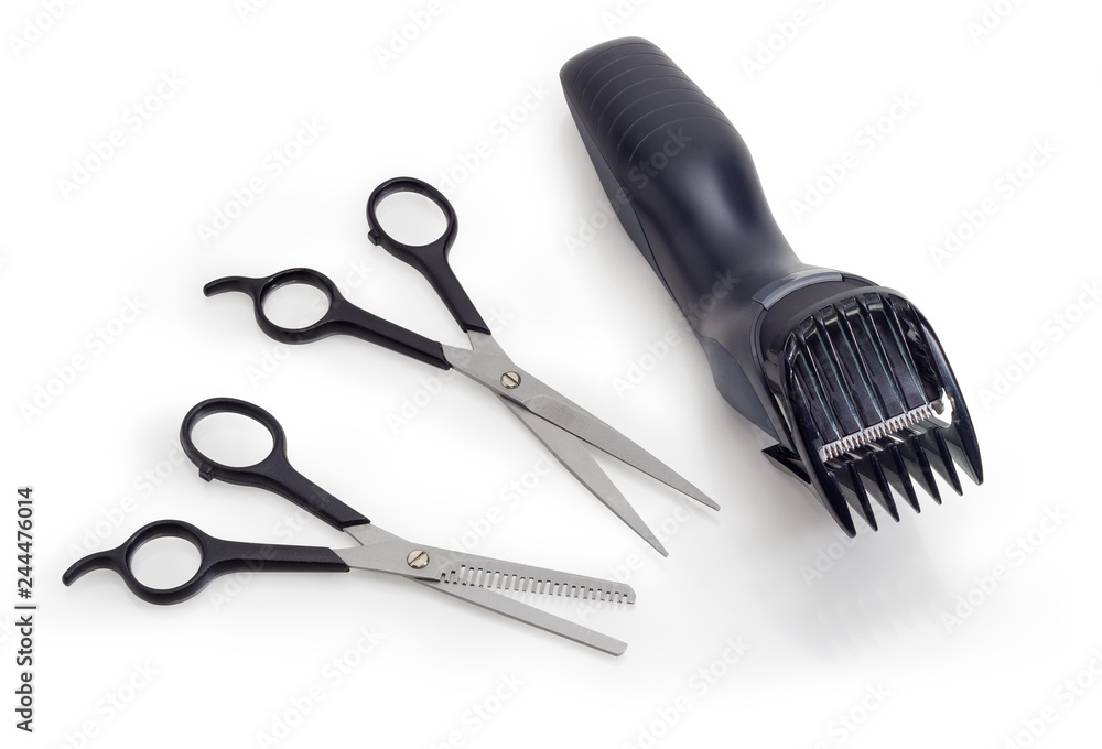 Obraz premium Electric hair clipper and two different professional hairdressers scissors