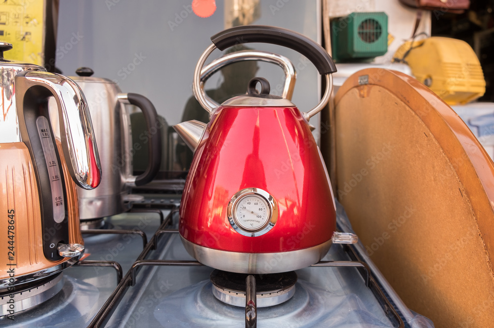 Vintage stylised electric kettles for sale at street market