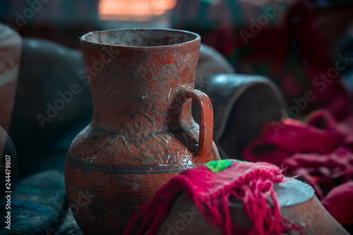 Photo of an old ancient ceramical clay jug on exhibition photo