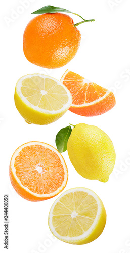 Falling lemon and orange isolated on white