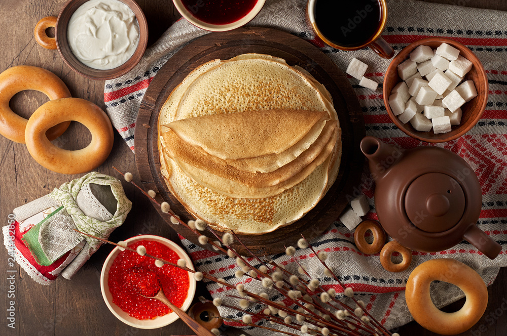 Shrovetide Maslenitsa Butter Week festival meal. Stack of russian pancakes blini