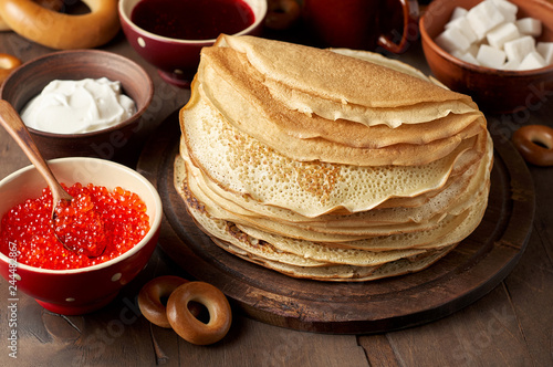 Shrovetide Maslenitsa Butter Week festival meal. Stack of russian pancakes blini photo