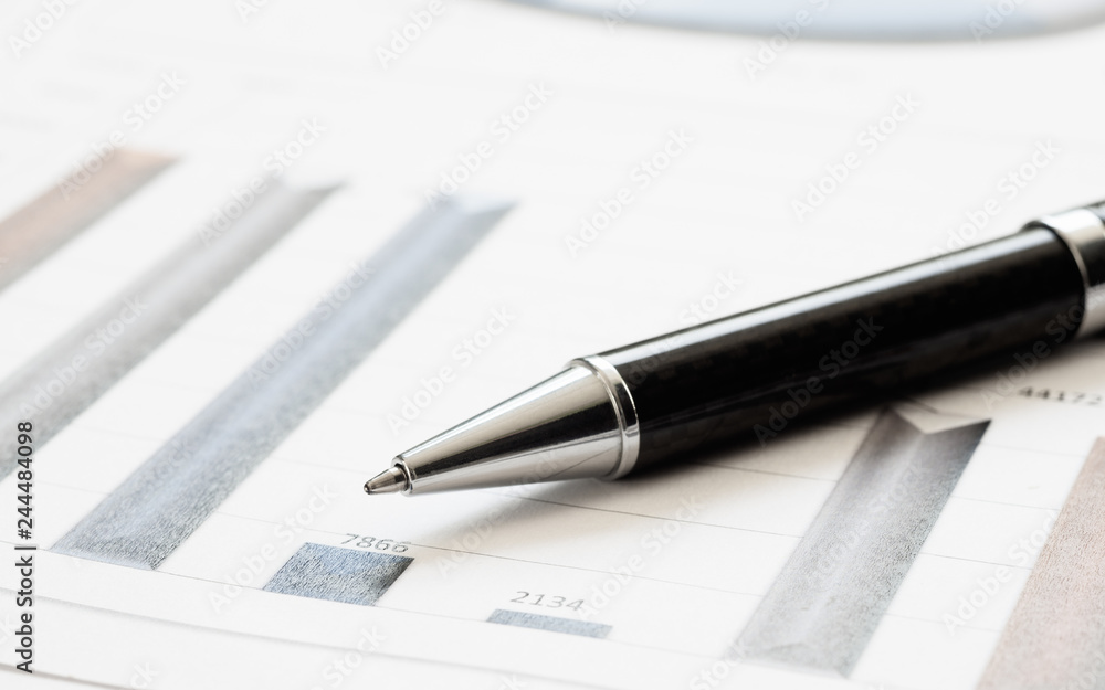 Close-up pen on financial report. Concept of Infomation Data Analysis, Business Investment Analytics and Business Planning. Web Banner. Close-up pen on financial report. Concept of Infomation Data Analysis, Business Investment Analytics and Business Planning. Web Banner.