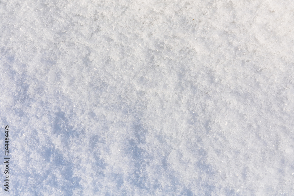 Texture of the white fluffy snow for background