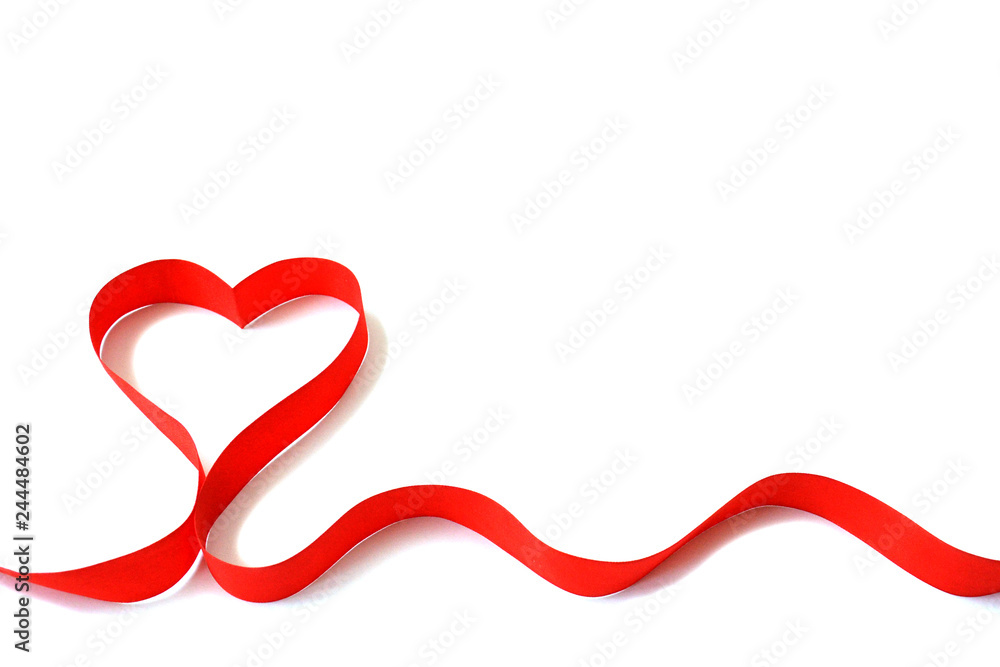 Isolated red satin ribbon in the shape of a heart on a white background with free space. The concept of love and Valentine Day Isolated red satin ribbon in the shape of a heart on a white background with free space. The concept of love and Valentine Day