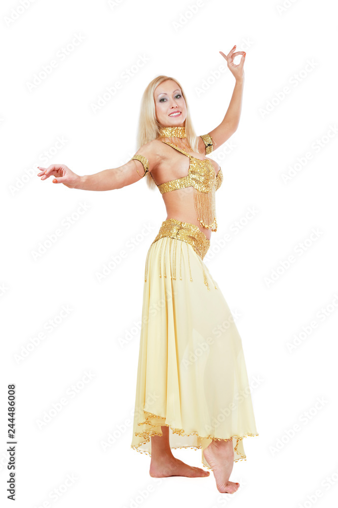 Beautiful blonde bellydancer in golden-yellow costume over white background Beautiful blonde bellydancer in golden-yellow costume over white background