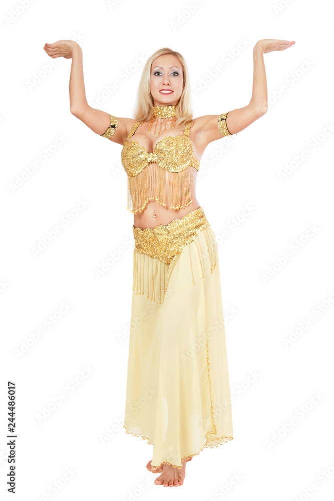 Beautiful blonde bellydancer in golden-yellow costume over white background Beautiful blonde bellydancer in golden-yellow costume over white background