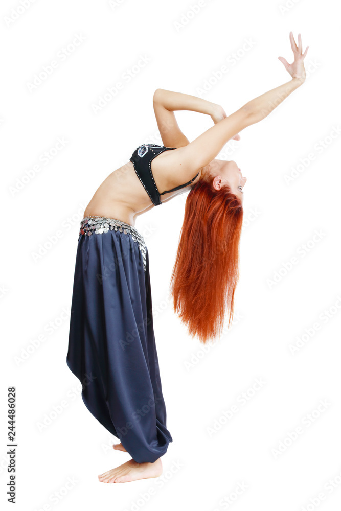 Belly-dancer with long red hair posing in oriental costume over white background Belly-dancer with long red hair posing in oriental costume over white background