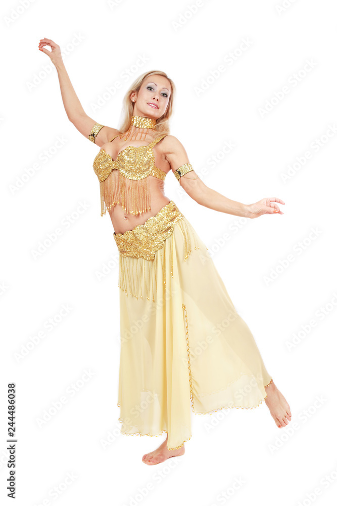 Beautiful blonde bellydancer in golden-yellow costume over white background Beautiful blonde bellydancer in golden-yellow costume over white background