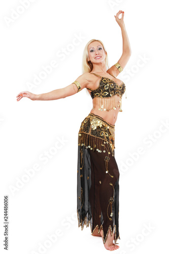 Beautiful blonde bellydancer in golden-black costume over white background