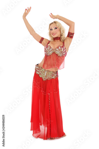 Belly-dancer in red oriental costume over white background