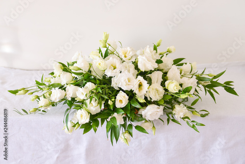 floral arrangement for interior decoration, table setting for a wedding or to create a home cosiness. use as background. white flowers bells