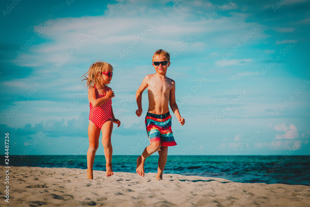 little boy and girl run play at beach little boy and girl run play at beach