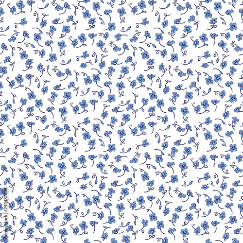 A lot of small blue flowers on a white background. Seamless pattern.