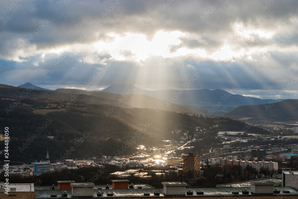 Fototapeta premium Cityscape panorama with sky heaven light sun rays, Usti nad Labem, Czech republic