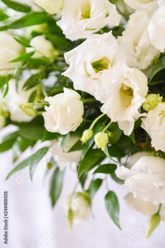 floral arrangement for interior decoration  table setting for a wedding or to create a home cosiness. use as background. white flowers bells