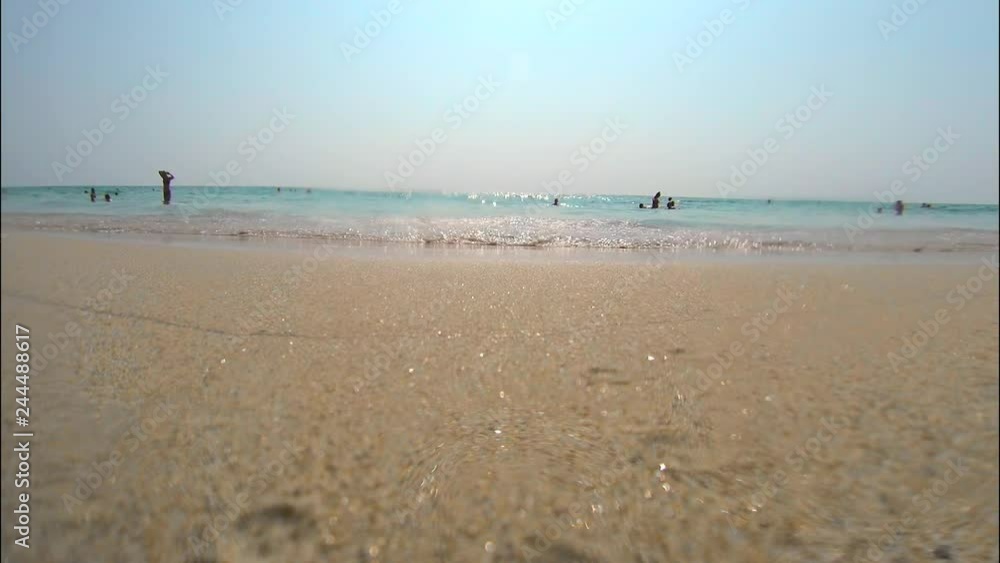 Small sea waves hitting directly at the camera, filmed on go Pro Small sea waves hitting directly at the camera, filmed on go Pro