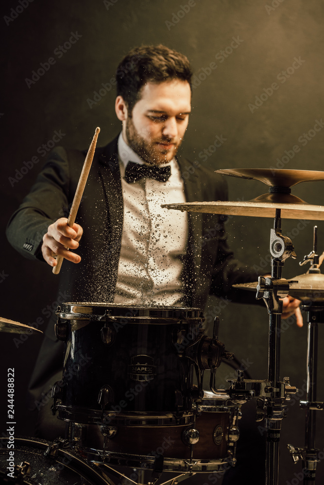 drummer plays in the hall poses drummer plays in the hall poses