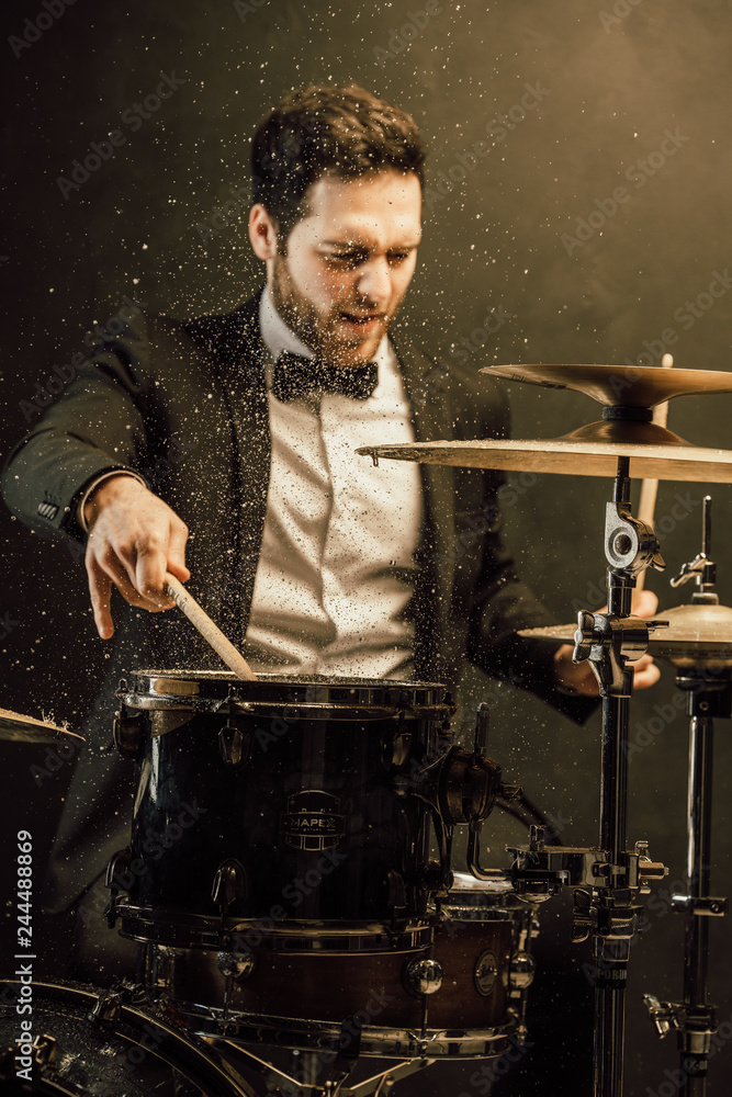 drummer plays in the hall poses drummer plays in the hall poses