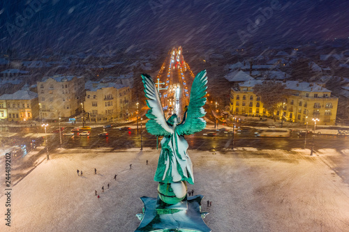 Canvas Print Budapest, Hungary - Aerial view of angel sculpture at Heroes' Square (Hosok tere) with Christmas decorated Andrassy street