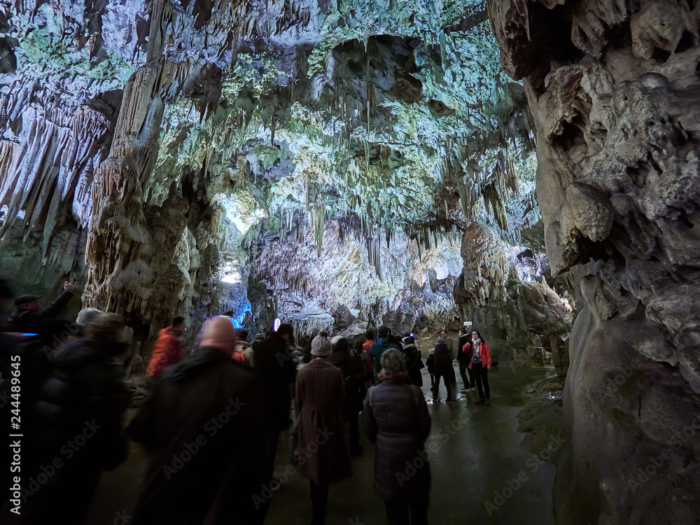 View of stalactites and stalagmites in an underground cavern - Postojna cave in Slovenia