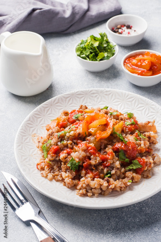 Buckwheat porridge with canned tomato and pepper.