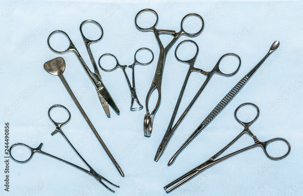 Fototapeta premium Sterilization of medical instruments. Steel Surgical Scissors and Clamps