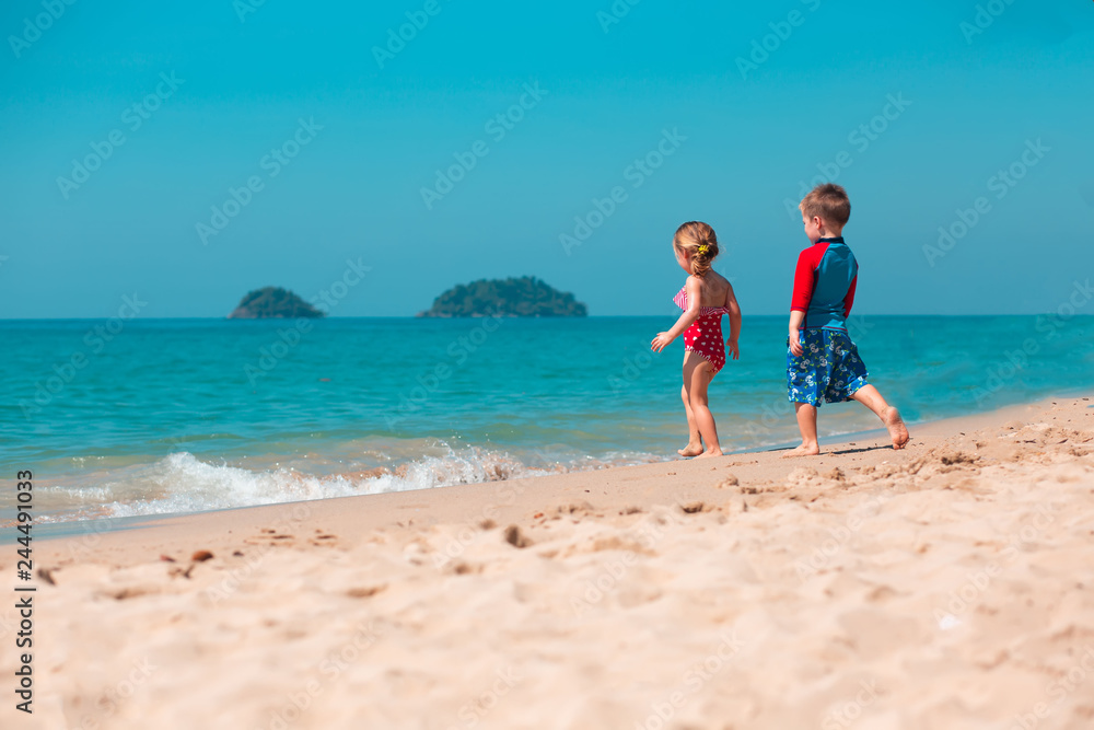 Little girl and boy on the beach, Koh Chang island