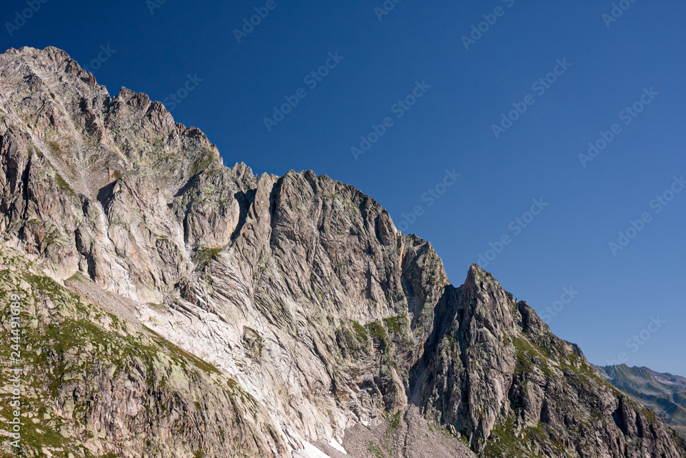 Panoramic view of the rock faces of Monte Cassina Baggio in the upper Bedretto valley in Switzerland Panoramic view of the rock faces of Monte Cassina Baggio in the upper Bedretto valley in Switzerland